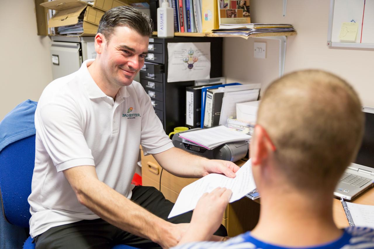 Barchester staff member talking to patient